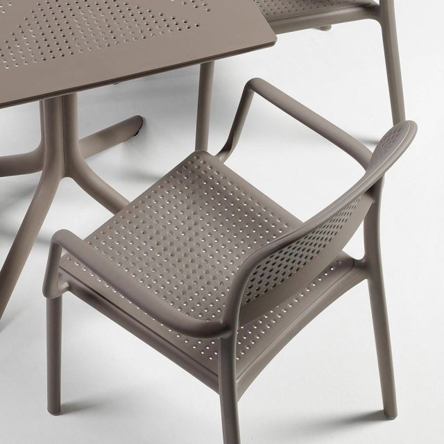 Nardi Bora outdoor dining chairs with arms at table