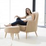 compact armchair with footstool