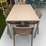 Nardi Doga Bistrot Tabacco chairs arranged around an outdoor dining table