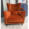 Fama Simone K aqua velvet armchair styled in a contemporary living space