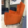 Side view of the Fama Simone K wingback armchair in Varenna 62 velvet